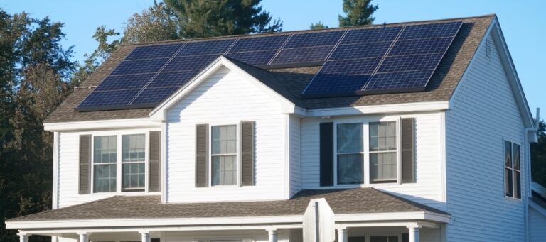 a two-story residential home with solar panels installed