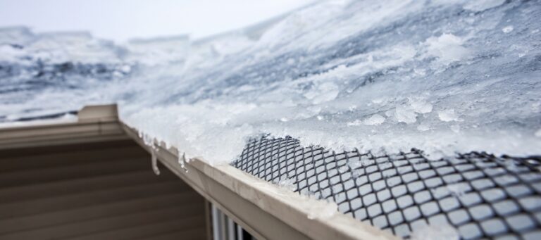 ice frozen over the edge of a gutter